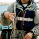 A man with sea snot dripping from his fingers.